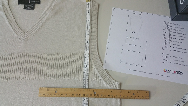 To accurately measure the armhole, place a straight edge (wood ruler) at the bottom of the armhole opening (ignore the band).  Measure from the straight edge to the shoulder seam.