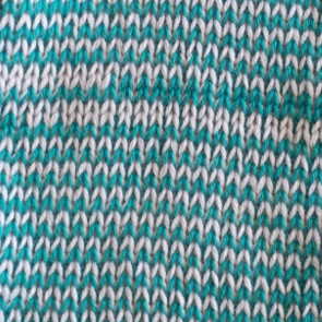 2 strands of equal weight "held together" in the same yarn feeder slot Knit side