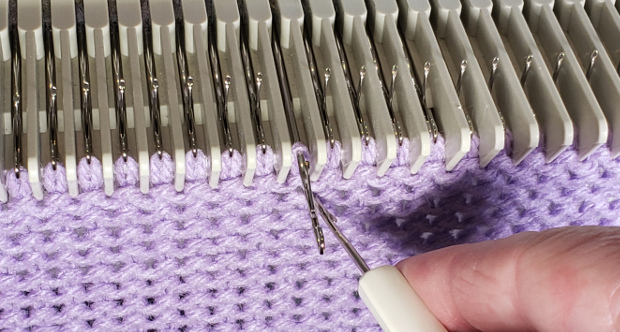 Pull the machine needle all the way out - putting the stitch behind the open latch