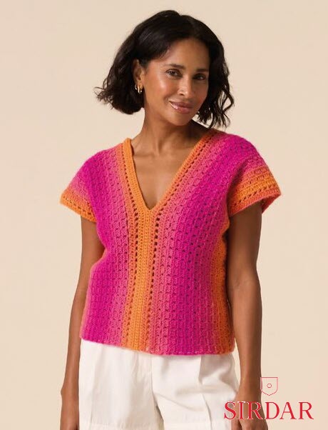 A person wearing a short-sleeved V-neck crochet top with vertical bands of magenta, orange, and pink.