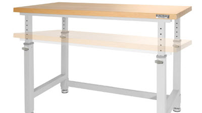 Empty UltraHD height-adjustable workbench with a thick light-wood top and white metal legs, shown against a white background with a ghosted lower tabletop position.